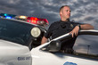 © Studio615 - EMERGENCY SERVICES - Gang Unit Police Officer getting out of vehicle