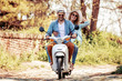 © ivanko80 - Couple in love riding a scooter