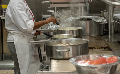 Wall Mural - Modern stainless steel hobs in commercial kitchen