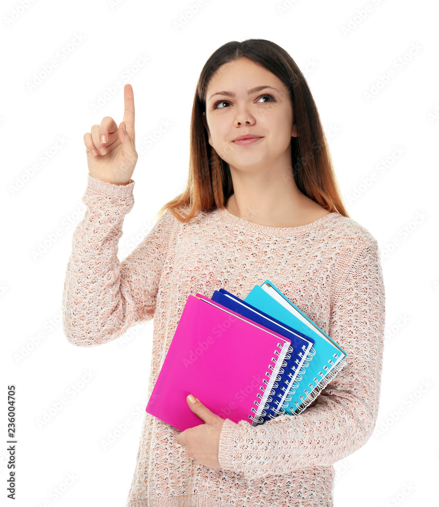 Teenage girl with notebooks on white background