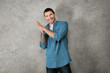 © Africa Studio - Young man in casual clothes on grey background
