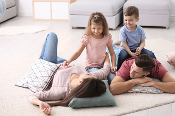 Wall Mural - Happy family with pillows at home