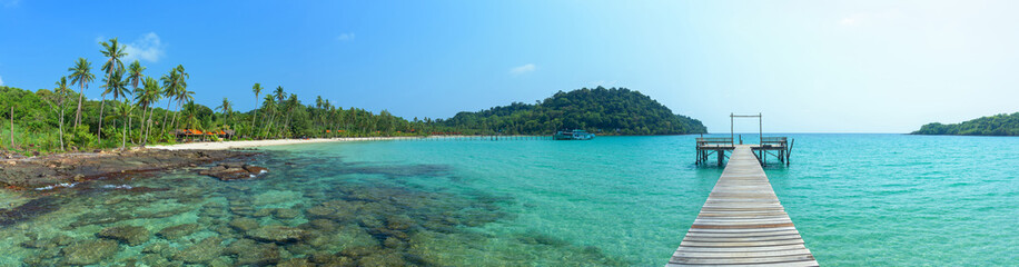 Wall Mural - Panoramic beautiful tropical island and long wooden bridge go to the sea, Thailand.