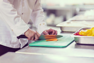 Wall Mural - Chef hands cutting fresh and delicious vegetables