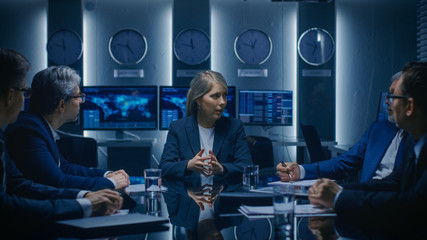 Wall Mural - Portrait of the Strong Minded Businesswoman Making a Speech and Negotiating Business Deal with Her Partners at the Meeting.