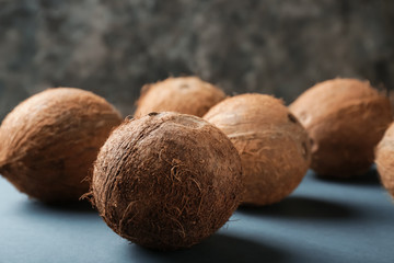 Ripe coconuts on grey background