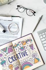 Wall Mural - the word creative drawn in a notebook