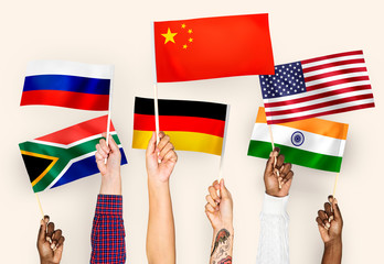 Wall Mural - Hands waving flags of China, Germany, India, South Africa, and Russia