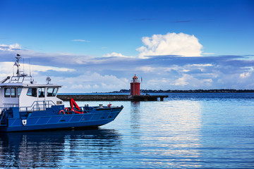 Wall Mural - Lighthouse on sea under the sky