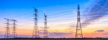 High-voltage Power Lines At Sunset,high Voltage Electric Transmission Tower