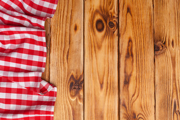 Wall Mural - checkered tablecloth on wooden table