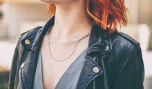 Close-up Of A Fashionable Woman Wearing A Minimalistic Silver Necklace