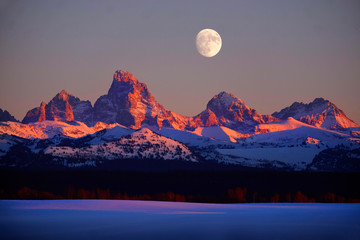 Sunset Light Alpen Glow on Tetons Teton Mountains wtih Moon Rising