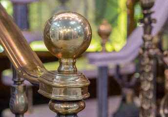 Bronze brilliant globe at the end ladder handrail.