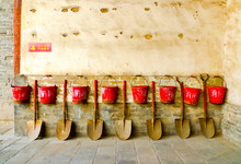 Eight Fire Buckets Hung On A Wall