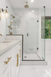 Bathroom Detail: Shower and Vanity in Ensuite Master Bathroom in New Luxury Home. Features Elegant Tile Floor