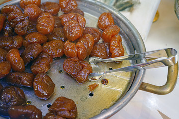 Wall Mural - Marrons glaces candied chestnuts in an Italian candy store