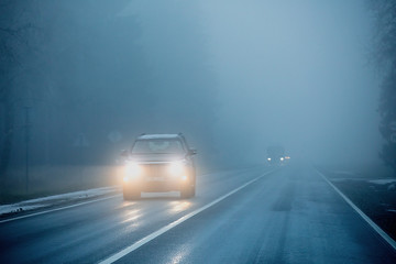 Cars on the road in the fog