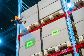 Poster - Drone scans barcode. Modern warehouse. Inventory in stock. Drone reads the barcode boxes in stock. Automation. Storage management. Responsible storage.