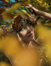 Art Portrait Of A Blond Nymph Posing In An Autumnal Park
