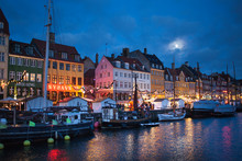 The Nyhavn Harbor District At Night In Copenhagen, Denmark
