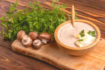 Wall Mural - Tasty pureed mushroom soup in wooden bowl with ingredients