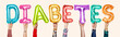 © Rawpixel.com - Hands showing diabates balloons word