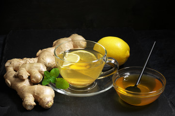 Wall Mural - Ginger tea with lemon in glass cup