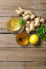 Canvas Print - Ginger tea with ingredients on wood