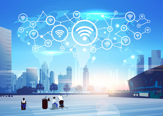 Wall Mural - people world map internet wireless technology icon network futuristic interface online wifi connection concept skyline sunset cityscape buildings background flat horizontal