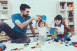 © Vadym Huzhva - Father and Sons is Playing with Toys