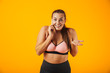© Drobot Dean - Portrait of a cheerful overweight fitness woman