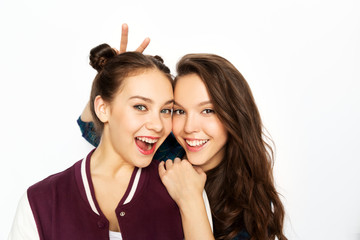 people and friendship concept - happy smiling pretty teenage girls over white background