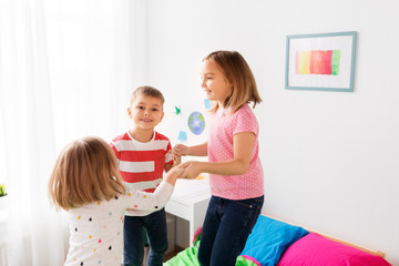 Poster - childhood, leisure and family concept - happy children playing at home