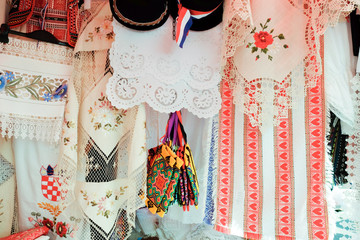 Croatian souvenir traditional tablecloths and towels sold at local market