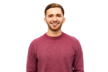 Poster - people concept - smiling young man in pullover over white background