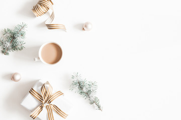 christmas composition. gift, fir tree branches, cup of coffee, balls on white background. christmas,