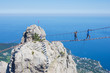 Suspension bridge over the abyss. Russia, Republic of Crimea. 06.13.2018. Suspension bridge on Mount Ai-Petri. Extreme attraction for tourists