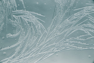 Snow patterns on glass as an abstract background