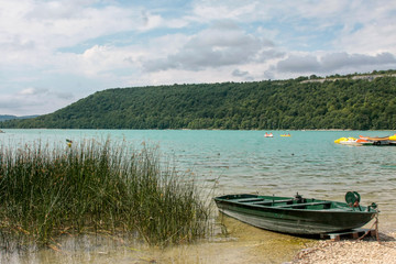  Little boat at Lake Chalain in Jura mountains, France.