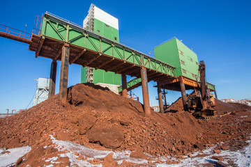 Underground gold iron ore mine shaft tunnel headframe ore stockpile