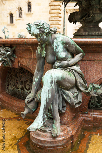 Fotografie, Obraz The figurine at the statue of Hygieia in Hamburg