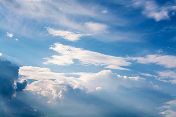 Wall Mural - white curly clouds in a blue sky. sky background