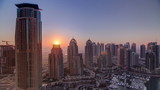 Fototapeta Miasto - Sunrise in Dubai Marina with towers and harbor with yacht from skyscrapper, Dubai, UAE timelapse 4K