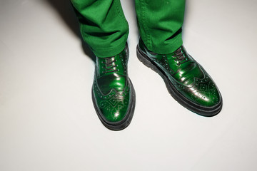 Pair of colourful green male classic shoes on white background