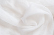White wrinkled old viscose silk. Thin tissue. random air folds. Viscose silk fabric texture background.