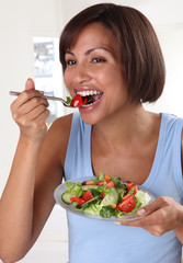 Wall Mural - WOMAN EATING MIXED SALAD