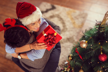 Couple exchanging Christmas presents