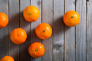 Sticker - little tangerines on old rustic wood table