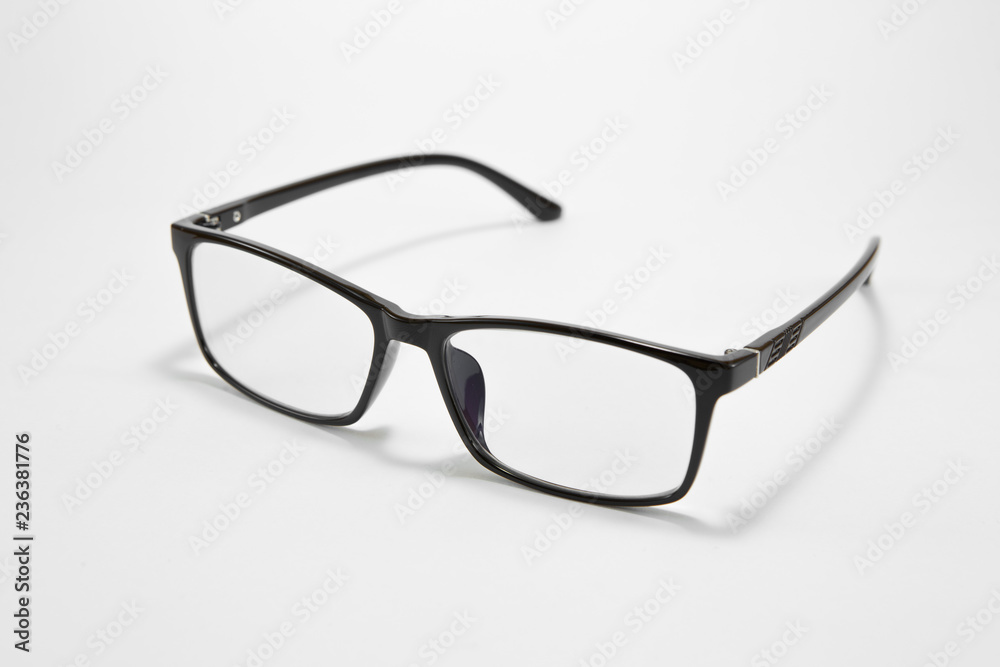 Black eyeglasses on a white background - obrazy, fototapety, plakaty 